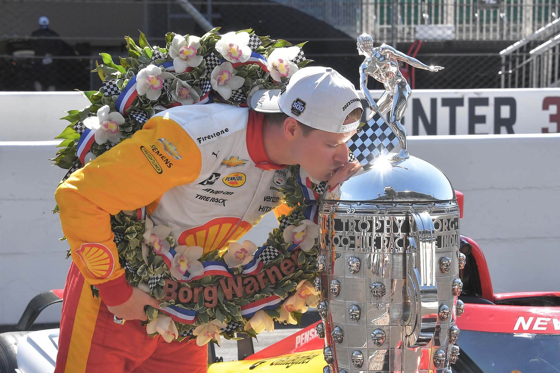 Man kisses silver trophy