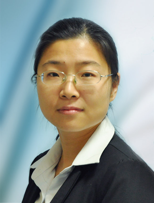 Woman in dark suit jacket and glasses against blue background