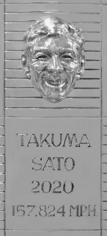 a single section of the Borg-Warner trophy featuring Takuma Sato's likeness in silver
