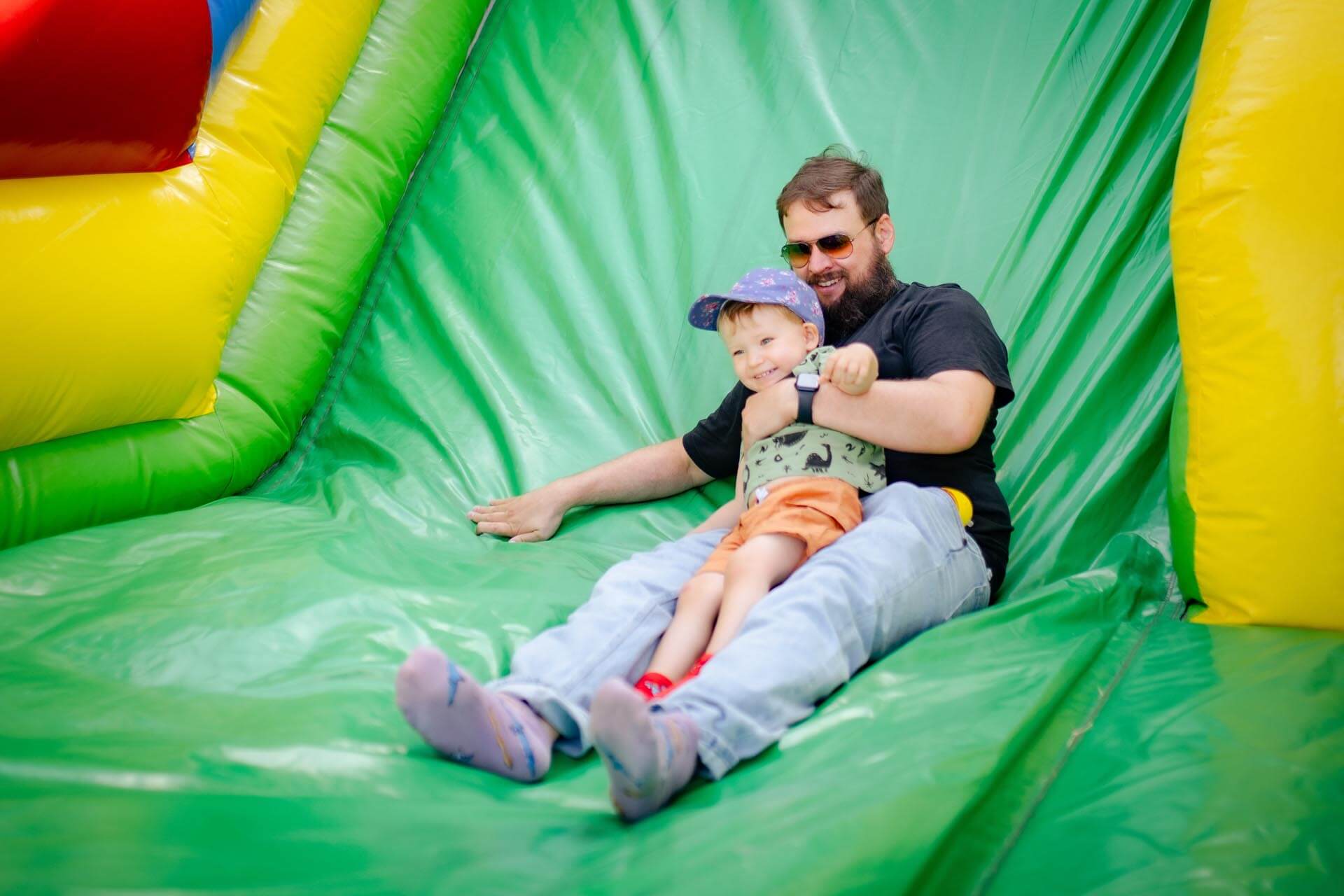 a man and child on a slide
